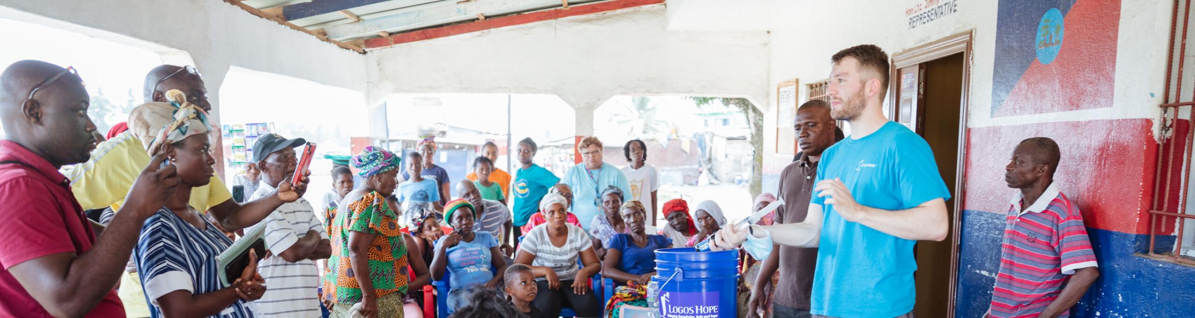 Monrovia, Liberia :: Jan Streitenberger (Germany) explains how to use the water purifiers donated by Logos Hope.