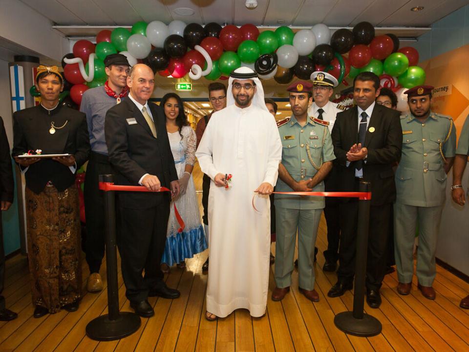 Guest of Honour His Highness Sheikh Mohammed bin Humaid Al Qasimi cuts a ribbon to officially open the book fair.