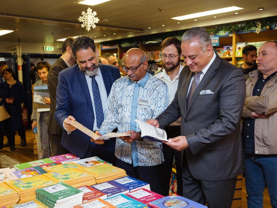 His Excellency Mr. Mohammad Mortada, Minister of Culture, Director General of Education, Imad Asmkar and Managing Director, Edward David (Malaysia) browse books in Logos Hope’s bookfair.