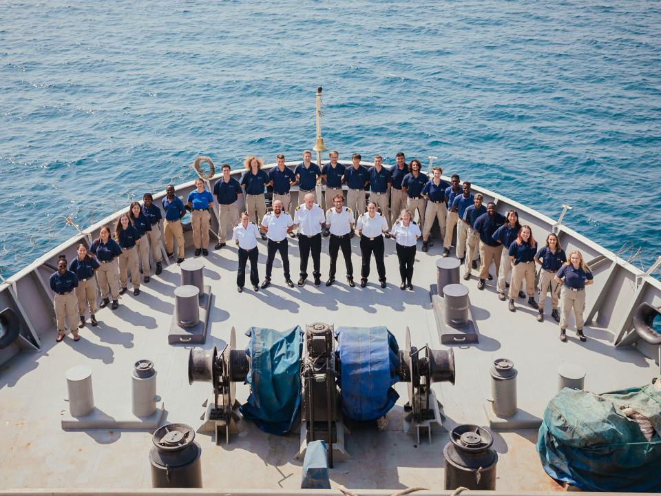 Logos Hope :: Deck department and officers pose for a photo on the bow.