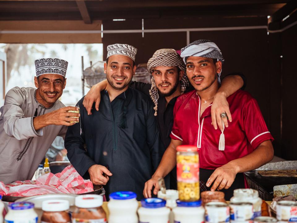 Salalah, Oman :: Local men smile for a photo.